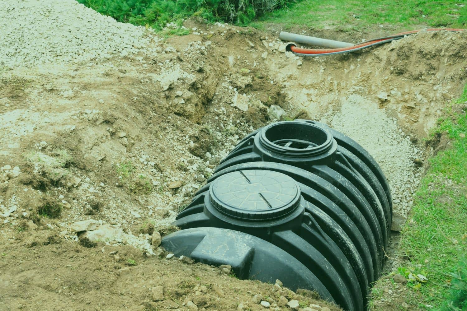 A polyethylene septic tank being installed in an excavated site, demonstrating a key physical component of how a septic system works in Central Florida.